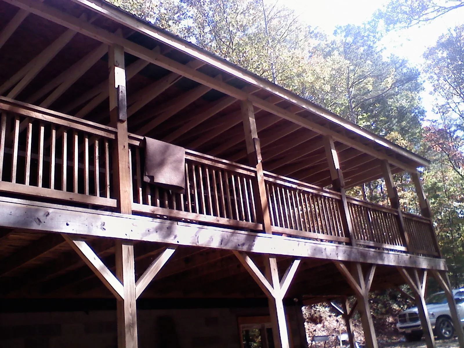 Timber framing under a new elevated porch and deck — Roof Leak Repair in Alpena by Roofing Brothers